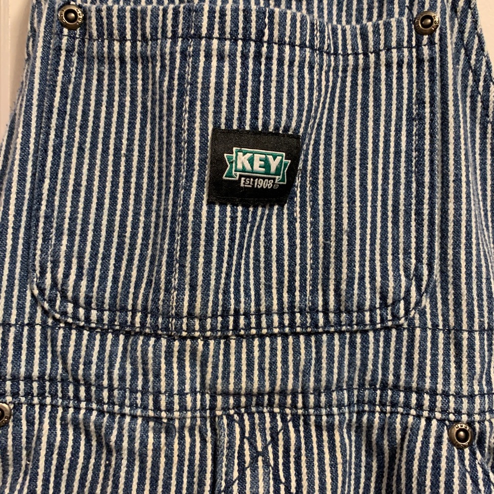 Boys overalls . size 6 conductor white and blue striped denim overalls .